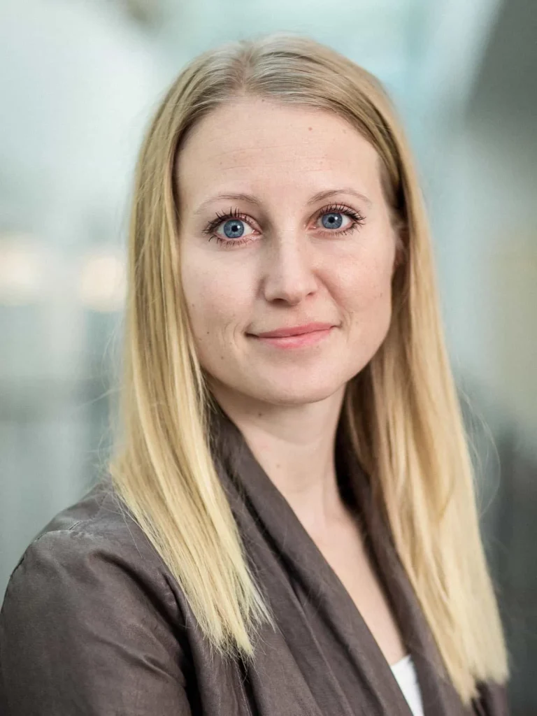 Business portrait of a woman with blonde hair and a dark blazer Business portrait of a woman with blonde hair and a dark blazer