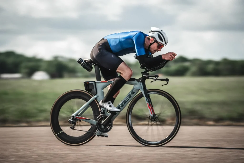 Cyclist in a blue jersey on a country road Cyclist in a blue jersey on a country road