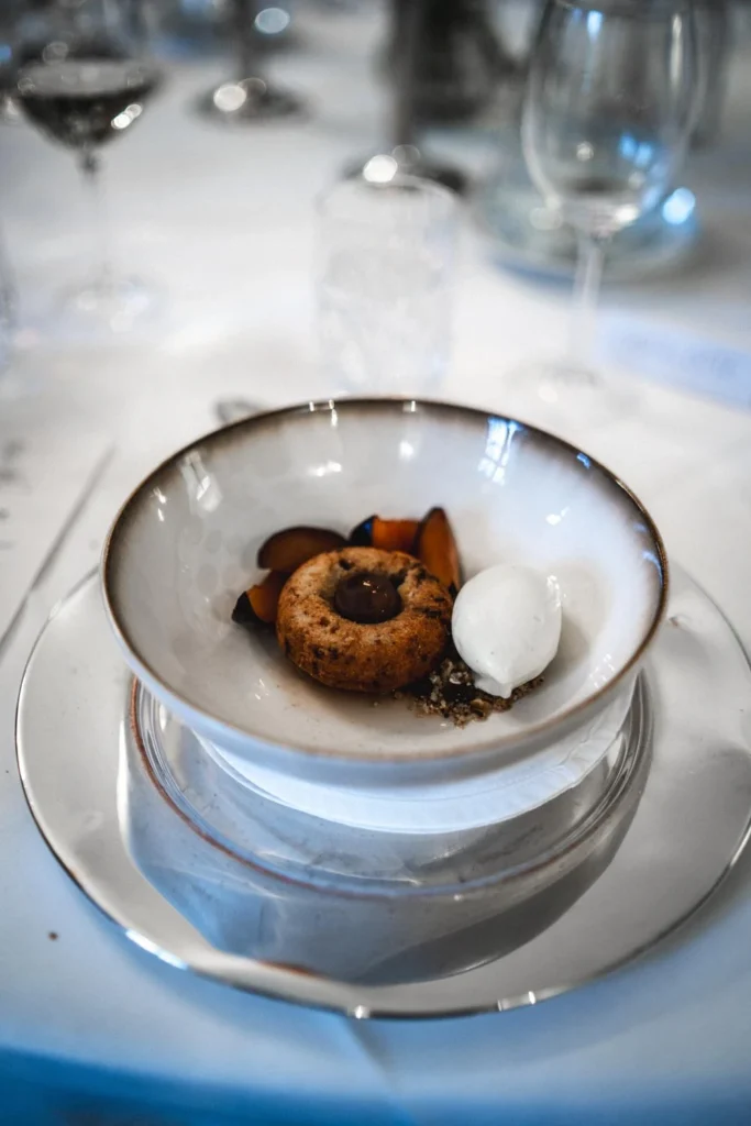 Dessert served on a white plate at a celebration table Dessert served on a white plate at a celebration table