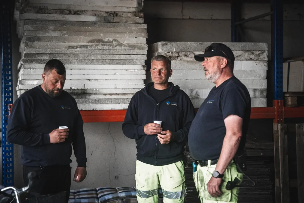 Employees talking together in an industrial building