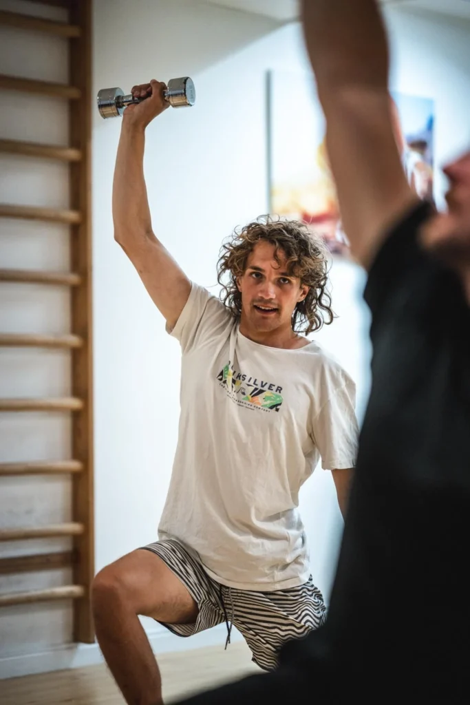 Person lifting a kettlebell during a workout Person lifting a kettlebell during a workout